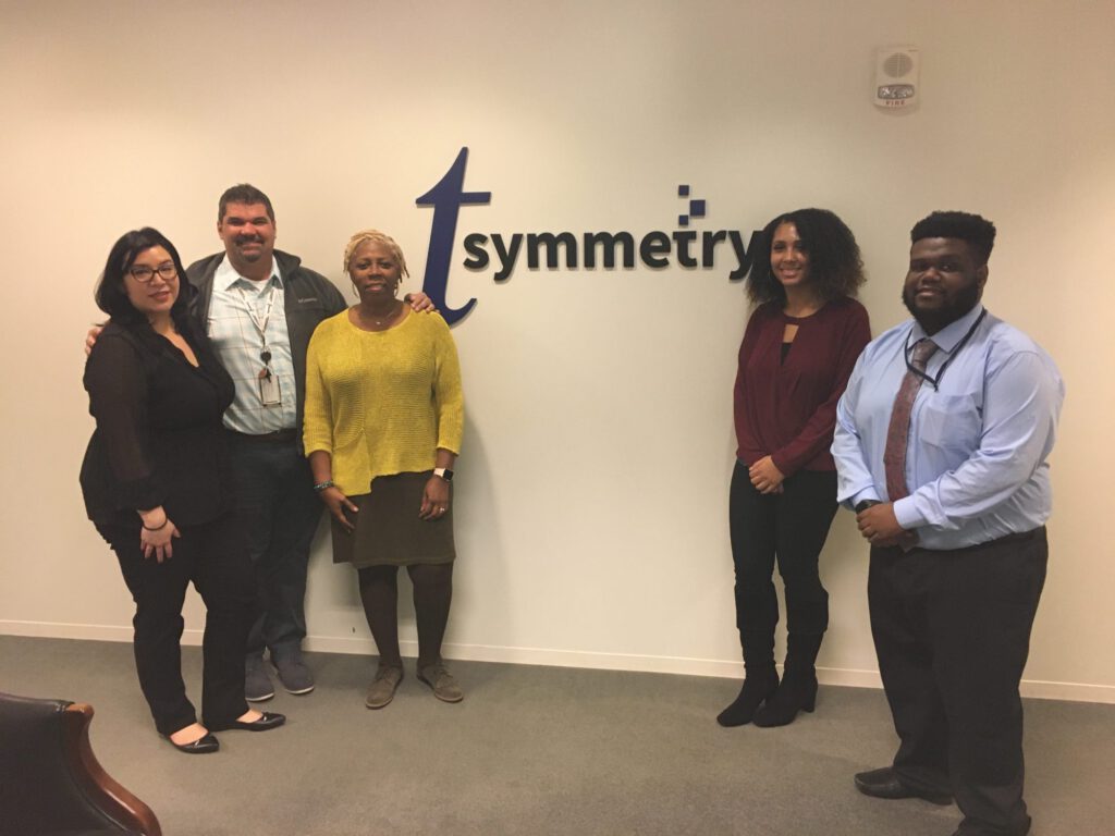 tsymmetry team members at office